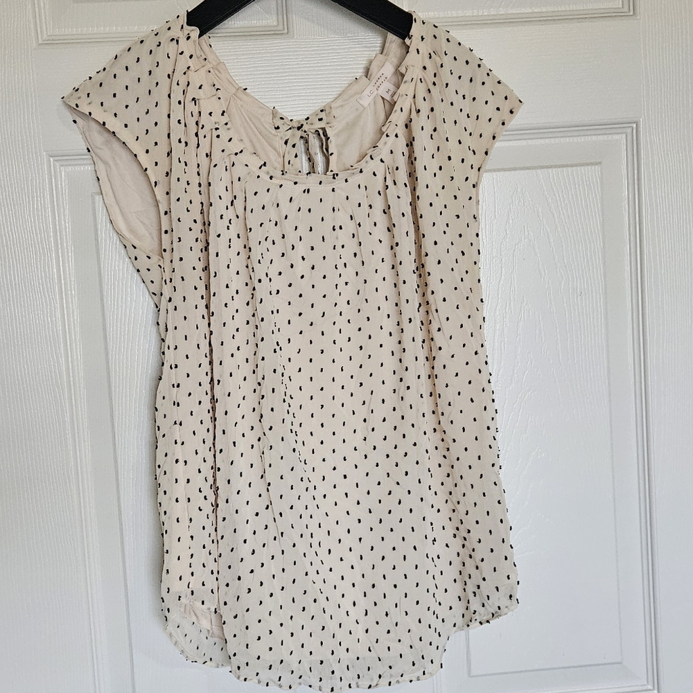Cream & Black polkadot sleeveless, bow detail in back, ruffle / pleated neckline